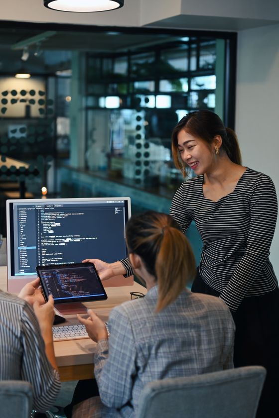 woman coding with people